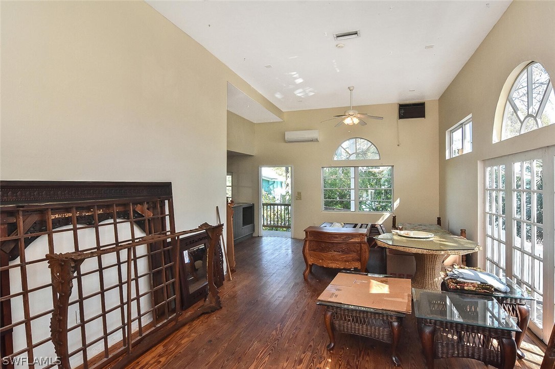 2480 Library Way Sanibel, FL 33957 - Photo 3 of 33 a living room with furniture and wooden floor