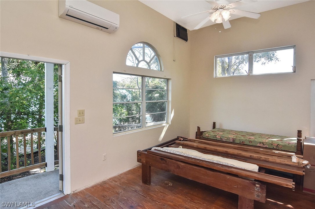 2480 Library Way Sanibel, FL 33957 - Photo 7 of 33 a room with furniture and windows