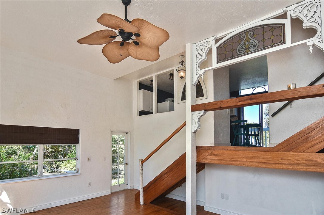 2480 Library Way Sanibel, FL 33957 - Photo 9 of 33 a view of staircase with wooden floor and a potted plant