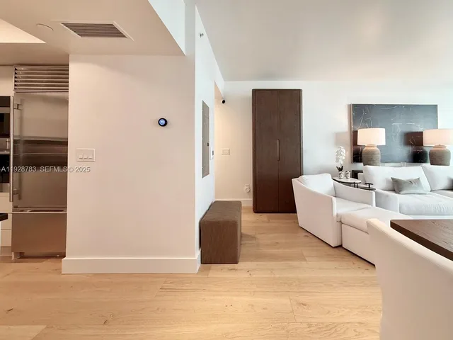 a living room with furniture and a lamp