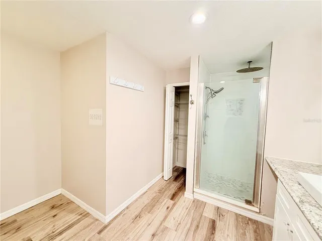 a bathroom with a double vanity sink and mirror