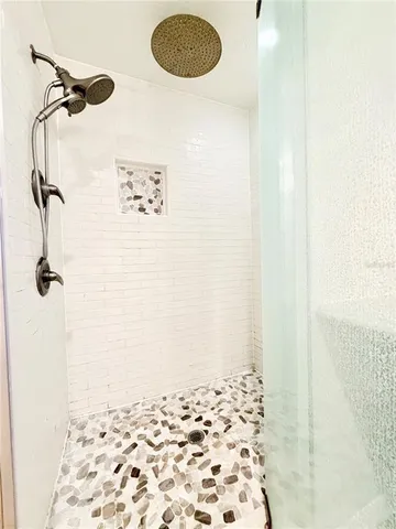 a large kitchen with stainless steel appliances granite countertop a sink and cabinets