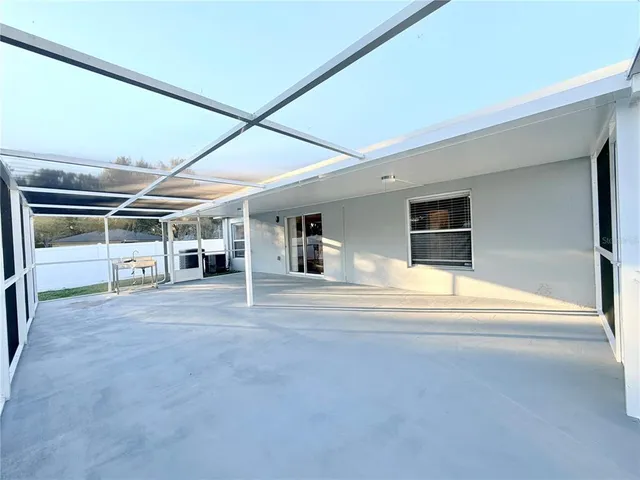 a view of hallway with a large window