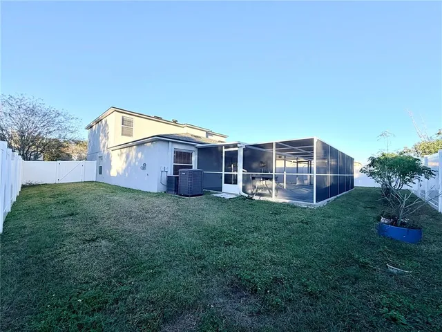 a view of a livingroom with a chandelier fan