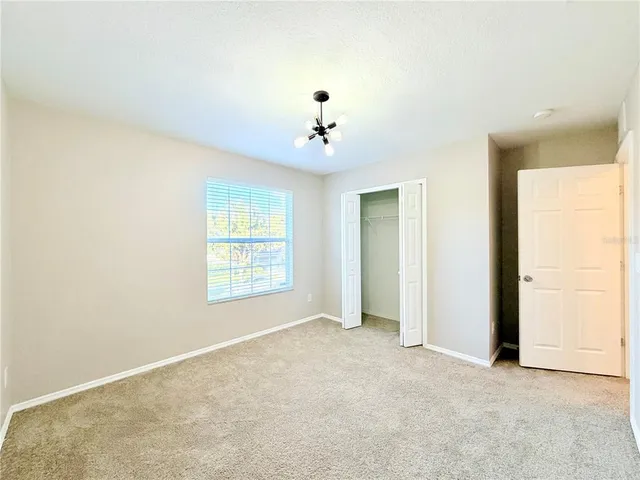 a view of a big room with carpet