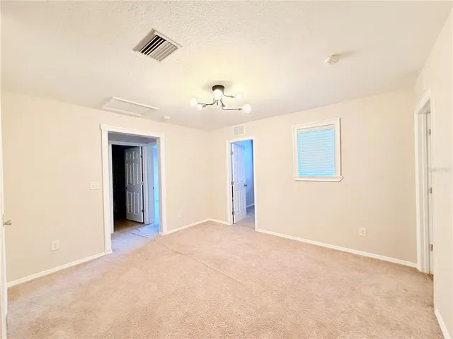 a sign on the wall next to a road