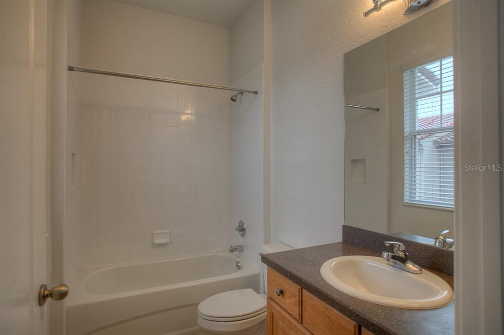 6021 Printery Street, Unit 106 Tampa, FL 33616 - Photo 21 of 23 a bathroom with a sink toilet and a bathtub
