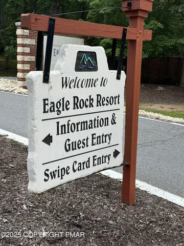 a front view of a house with a garden and plants