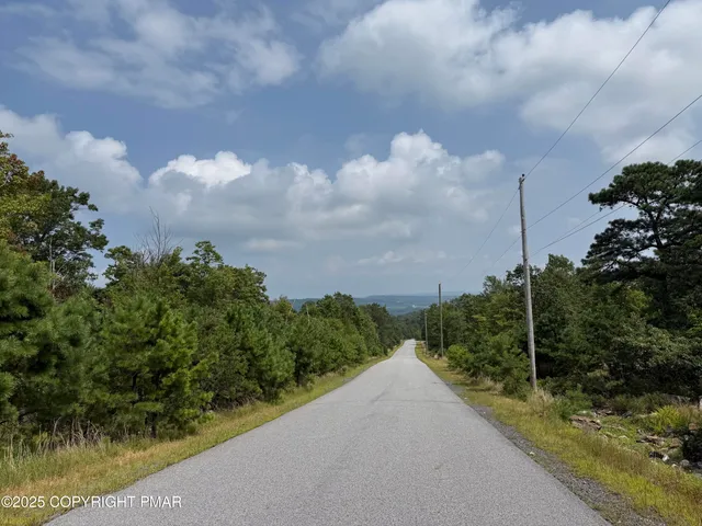 a front view of a house with a yard table and chairs