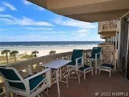 a bedroom with a bed and large window