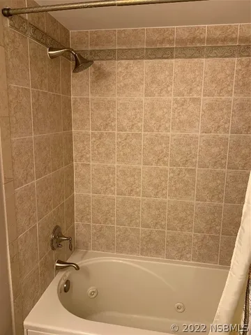 a living room with furniture and a flat tv screen