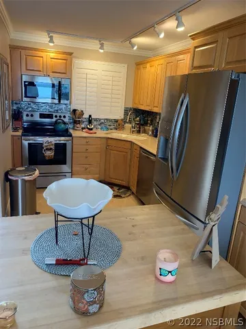 a kitchen with a stove and a sink