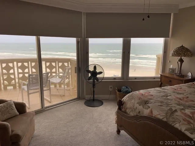 a swimming pool with outdoor seating and yard