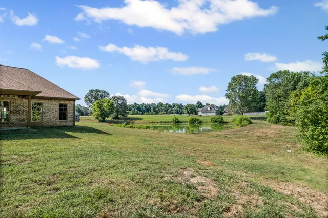 a view of a house with a big yard