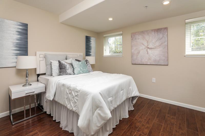 116 Pacchetti Way Mountain View, CA 94040 - Photo 17 of 24 a bedroom with a bed and a lamp