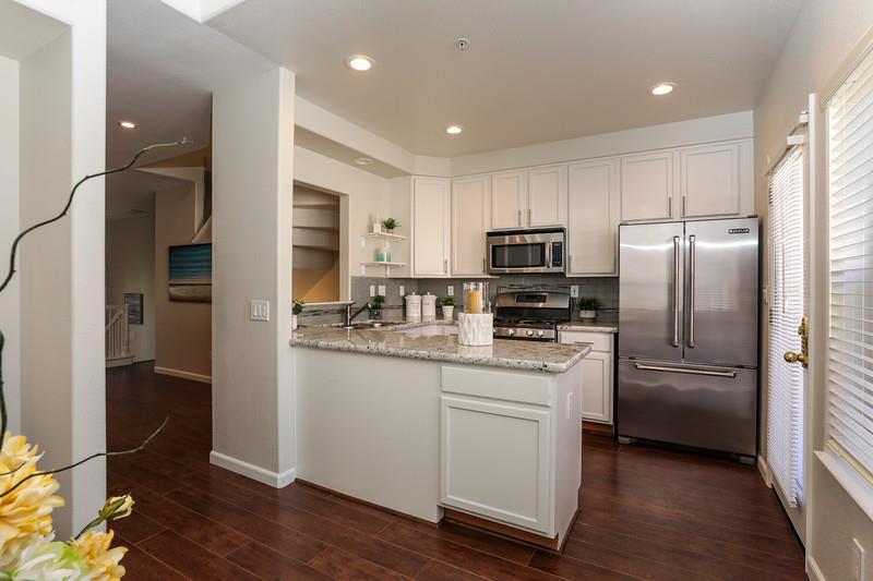 116 Pacchetti Way Mountain View, CA 94040 - Photo 8 of 24 a kitchen with cabinets stainless steel appliances and wooden floor