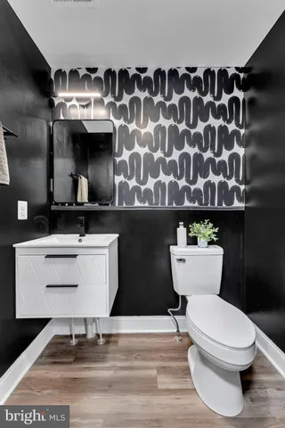 a bathroom with a toilet and a sink