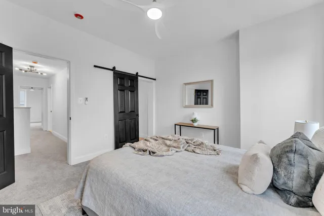 a bedroom with a bed and a cabinets