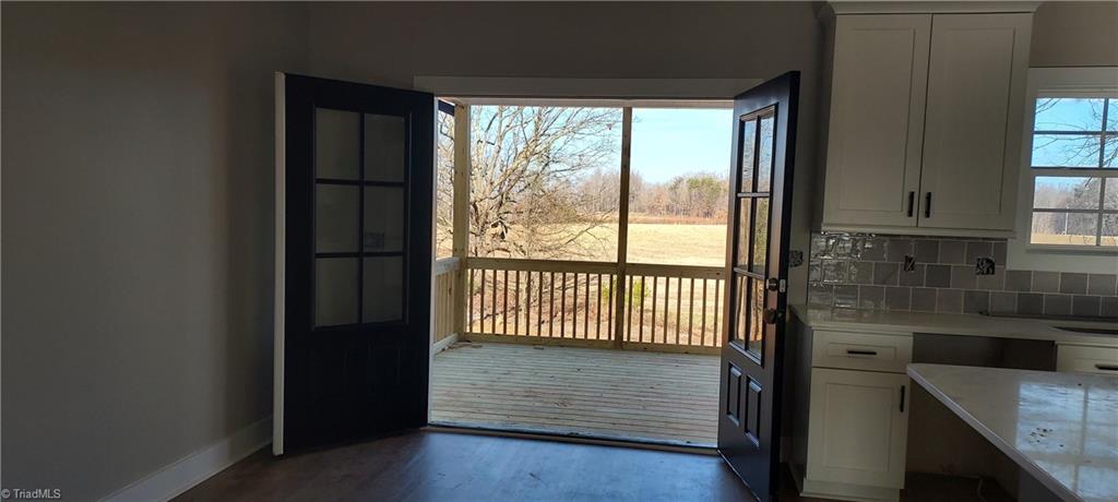 2754 Sandy Cross Road Reidsville, NC 27320 - Photo 6 of 17 Double Doors in the Dining Area that open to the Covered Porch with this amazing view!