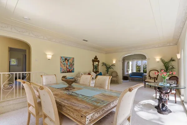 a backyard of a house with barbeque oven table and chairs