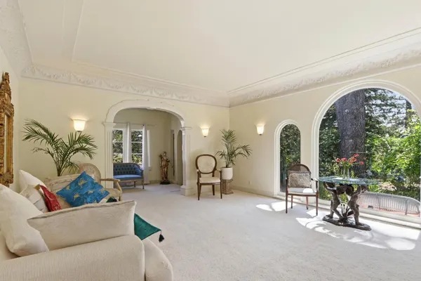 a bathroom with a sink a toilet a mirror a vanity and shower