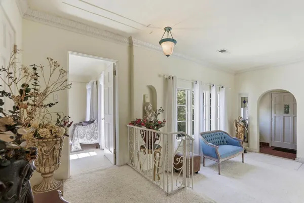 a view of a workspace with furniture and a workspace