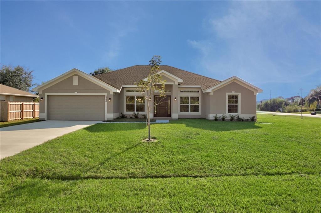 551 Quarry Lane Sebastian, FL 32958 - Photo 1 of 23 a front view of a house with a yard