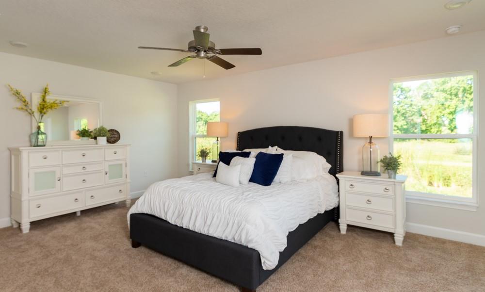 551 Quarry Lane Sebastian, FL 32958 - Photo 17 of 23 a bedroom with a bed and a dresser