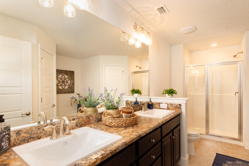 551 Quarry Lane Sebastian, FL 32958 - Photo 18 of 23 a bathroom with a granite countertop sink and a mirror