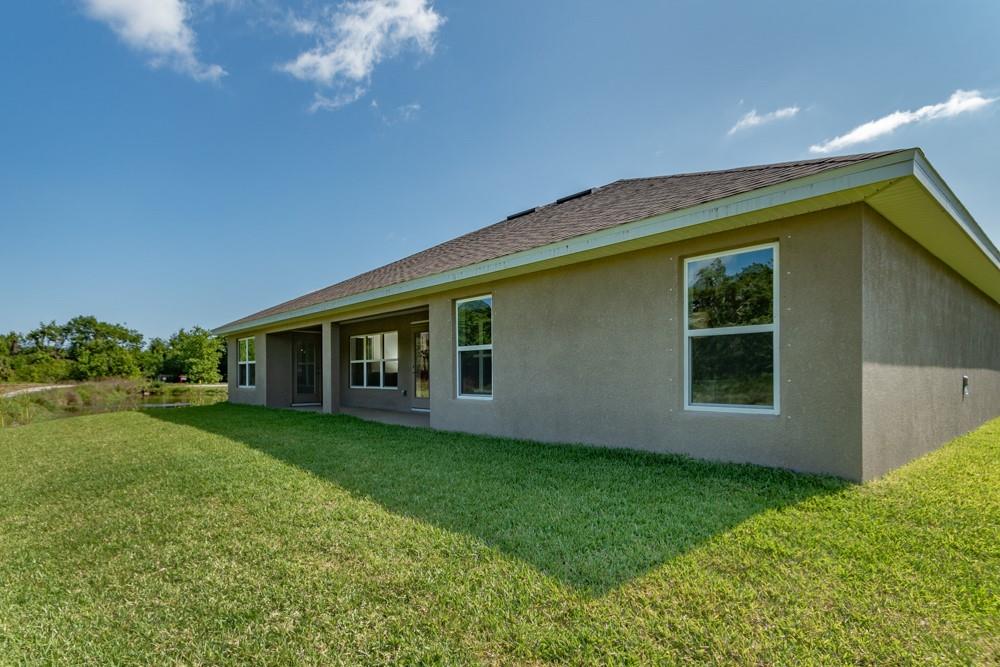 551 Quarry Lane Sebastian, FL 32958 - Photo 23 of 23 a front view of house with yard and green space