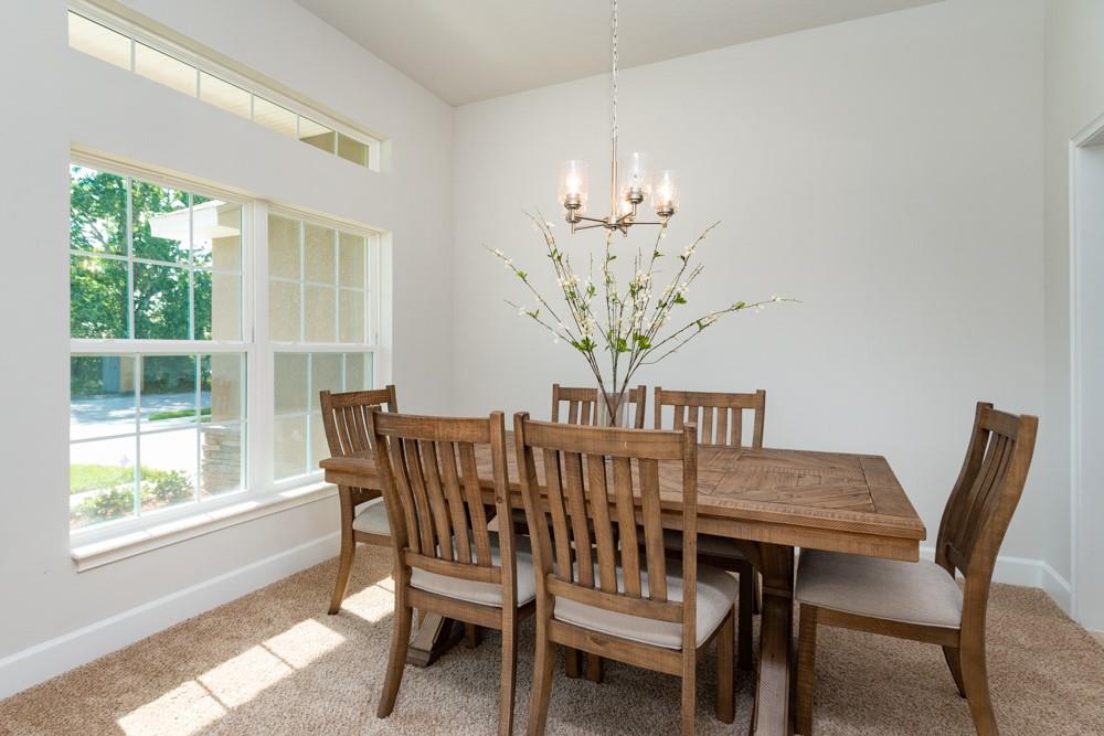 551 Quarry Lane Sebastian, FL 32958 - Photo 3 of 23 a view of a dining room with furniture window and outside view