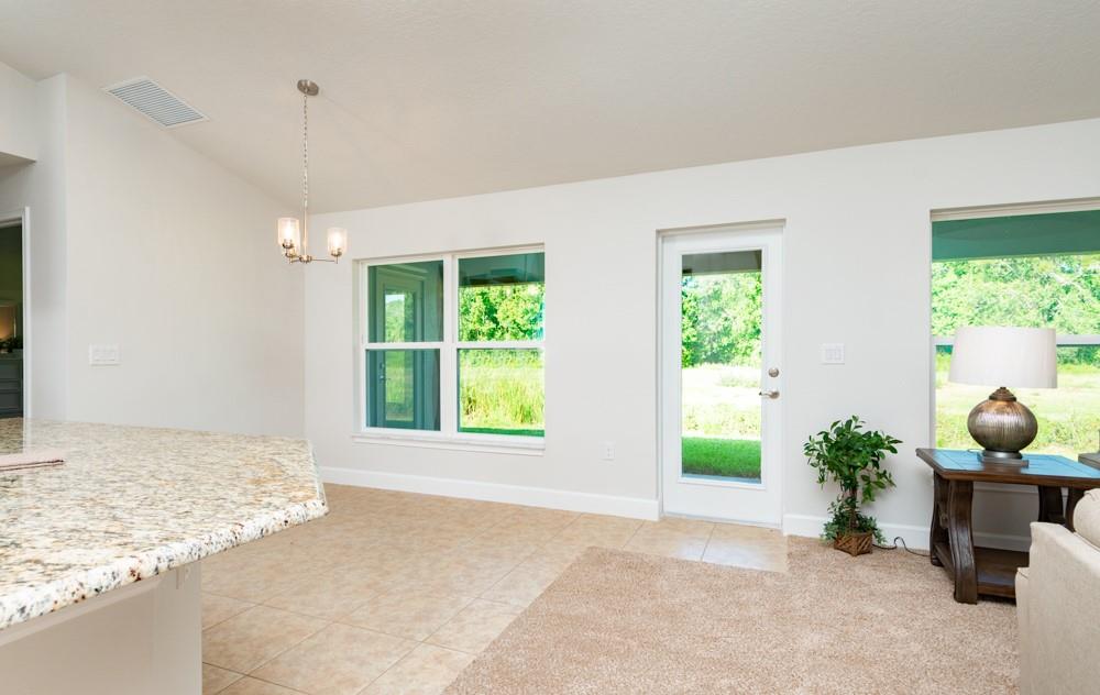 551 Quarry Lane Sebastian, FL 32958 - Photo 6 of 23 a view of a room that has a bed and a potted plant
