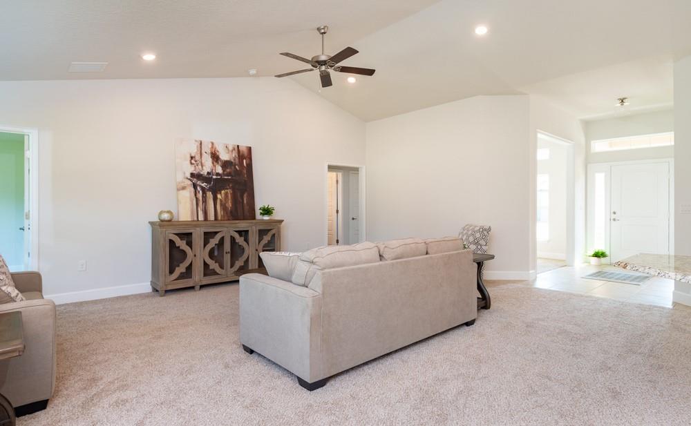 551 Quarry Lane Sebastian, FL 32958 - Photo 7 of 23 a living room with furniture and a chandelier