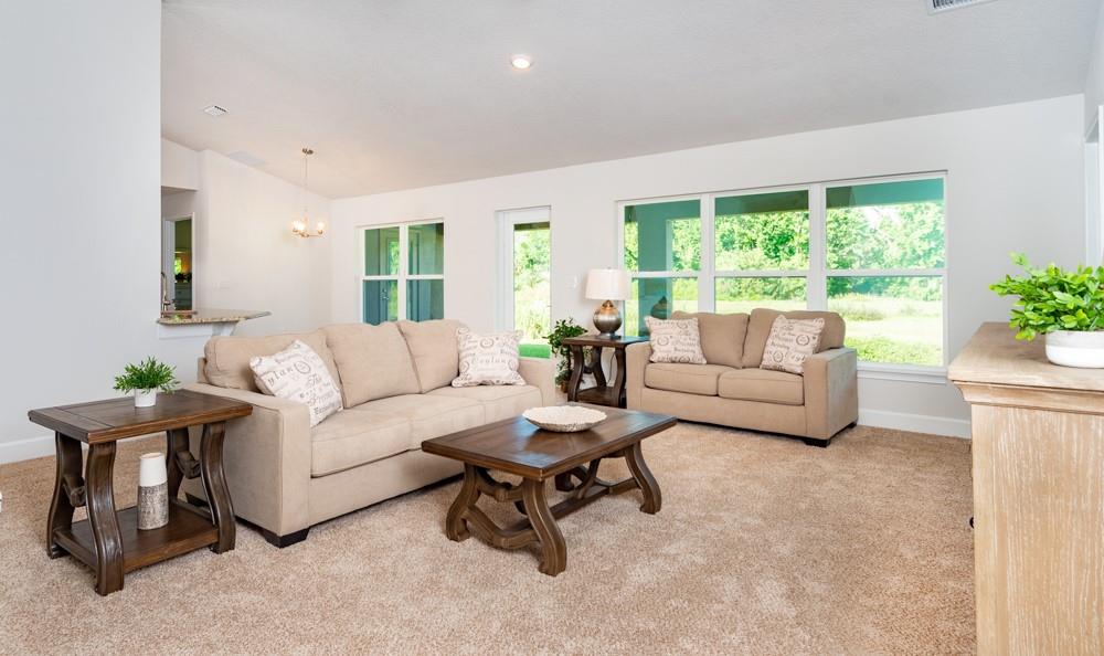 551 Quarry Lane Sebastian, FL 32958 - Photo 9 of 23 a living room with furniture and a large window