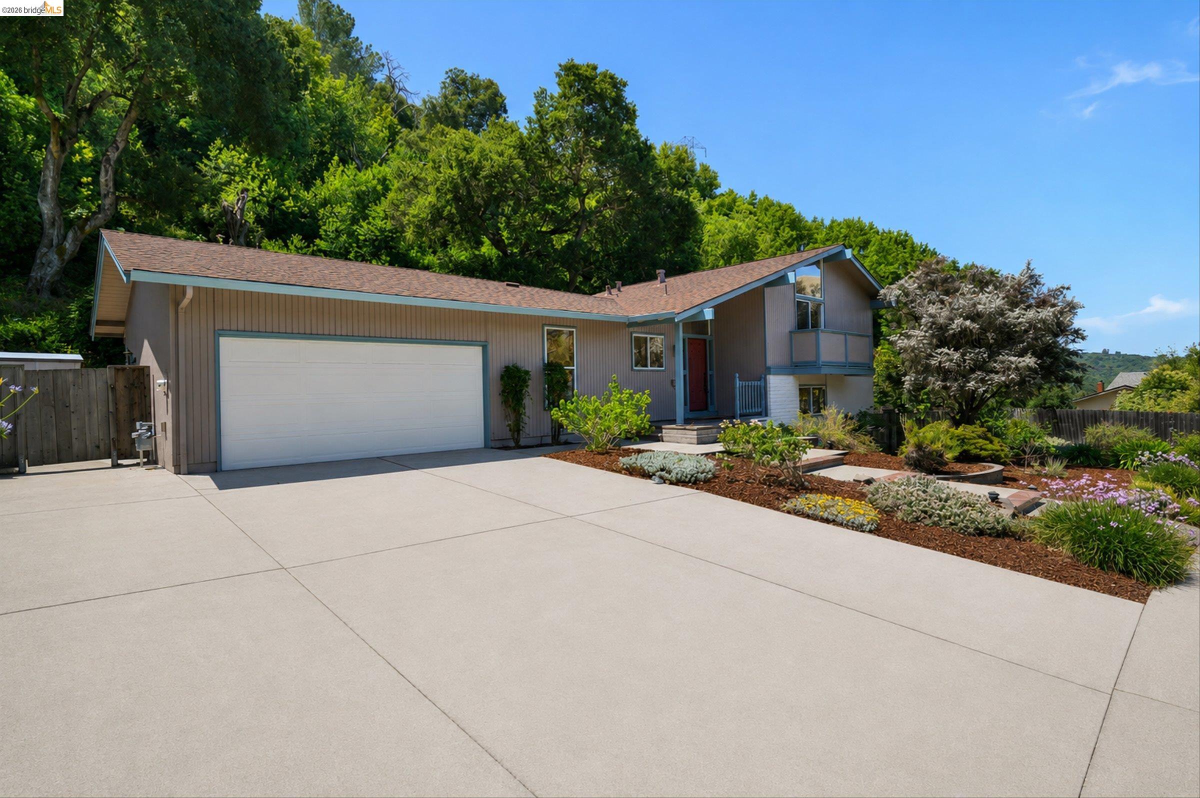 2826 Wright Avenue Pinole, CA 94564 - Photo 5 of 70 Contemporary exterior featuring a split-level design, attached garage, and a concrete driveway