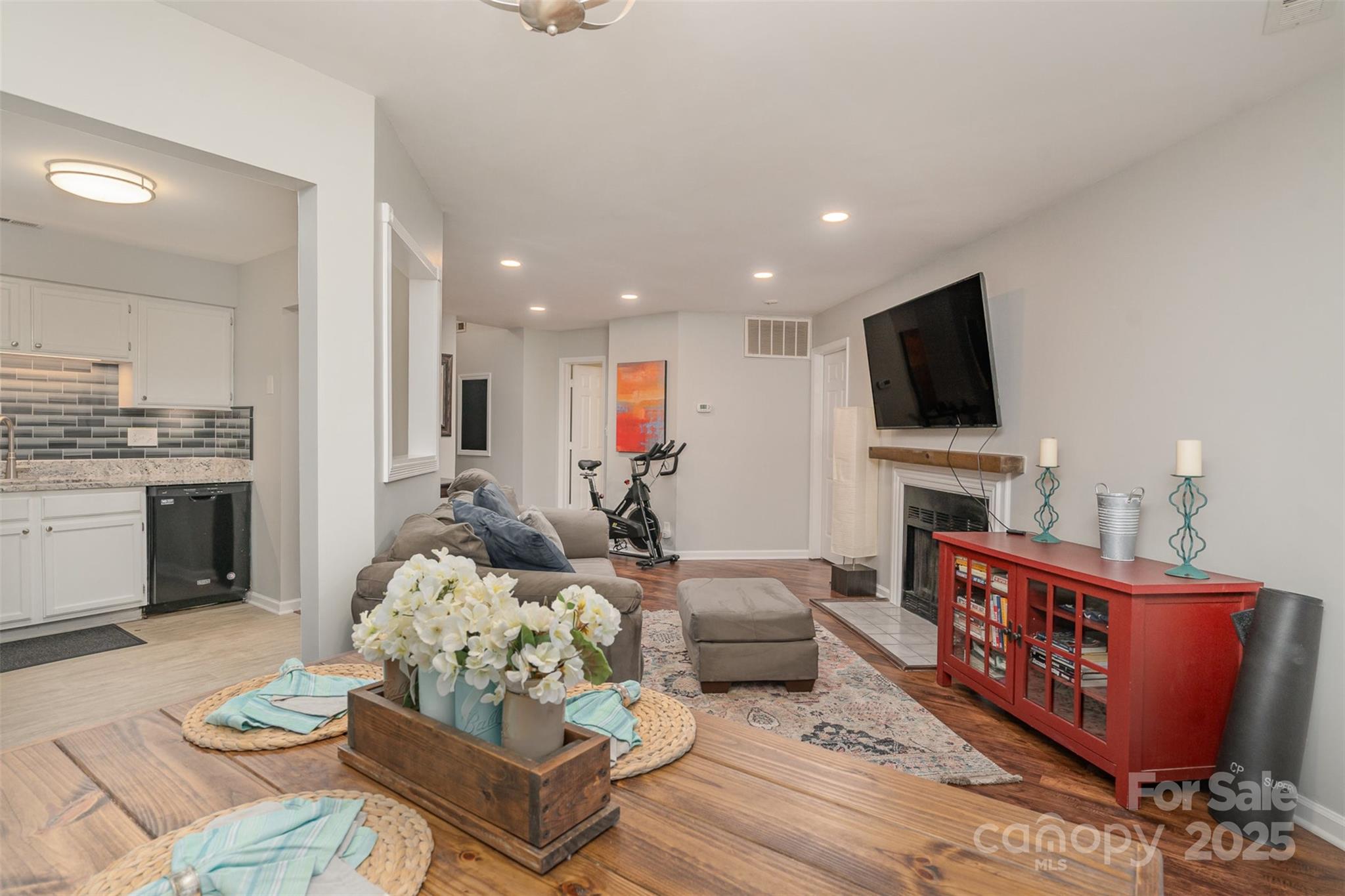 6501 Clavell Lane, Unit B Charlotte, NC 28210 - Photo 3 of 13 a living room with furniture and a flat screen tv