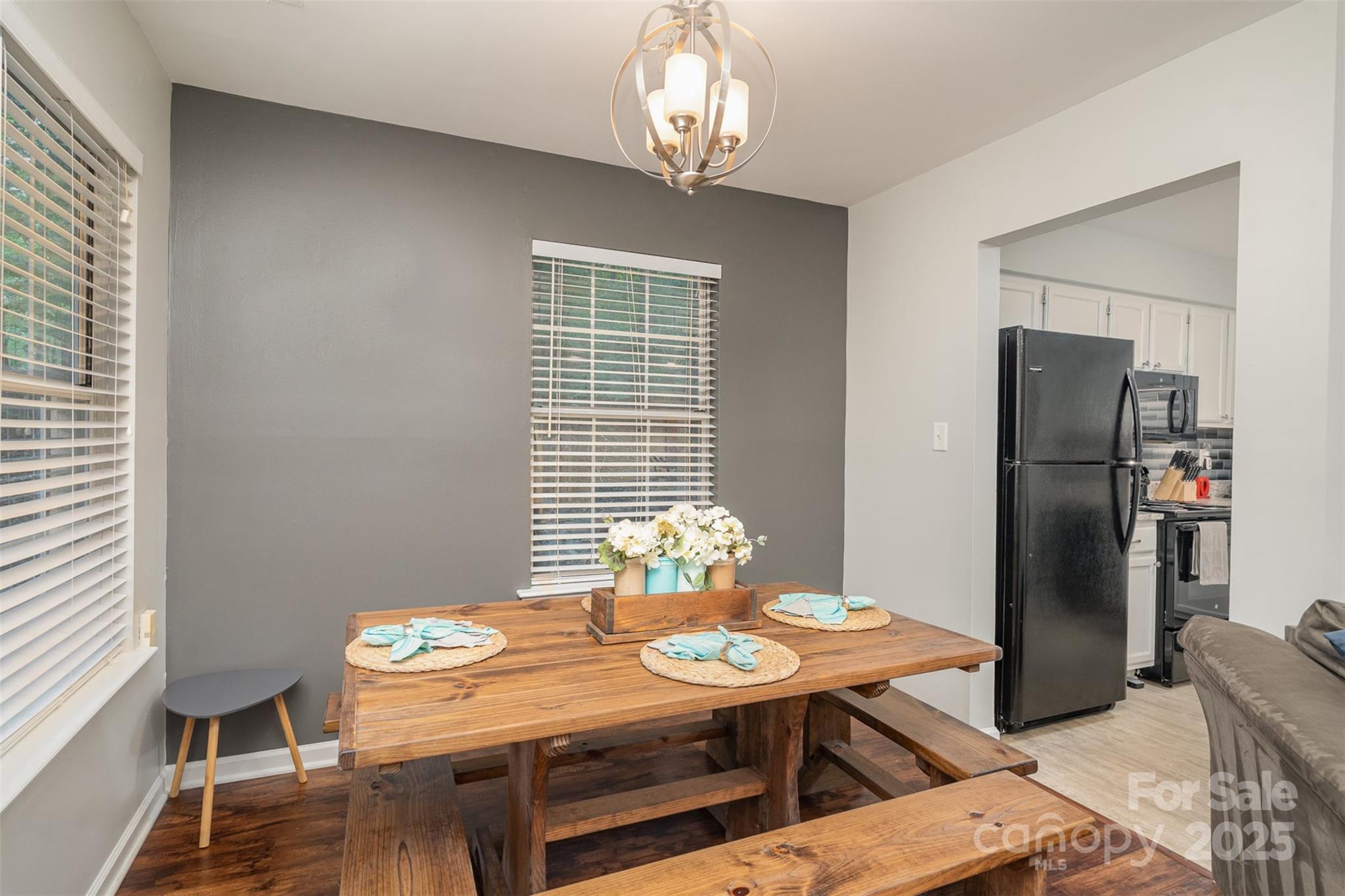 6501 Clavell Lane, Unit B Charlotte, NC 28210 - Photo 8 of 13 a view of a dining room with furniture window and wooden floor