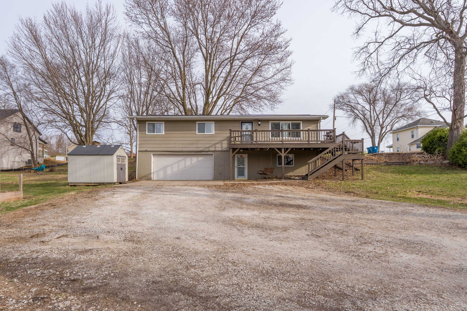 214 South 3rd Street Le Claire, IA 52753 - Photo 1 of 40 a front view of a house with a yard and garage