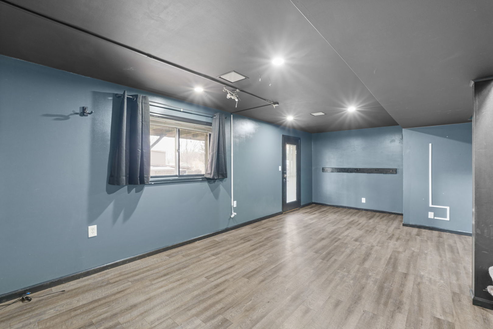 214 South 3rd Street Le Claire, IA 52753 - Photo 22 of 40 an empty room with wooden floor and windows