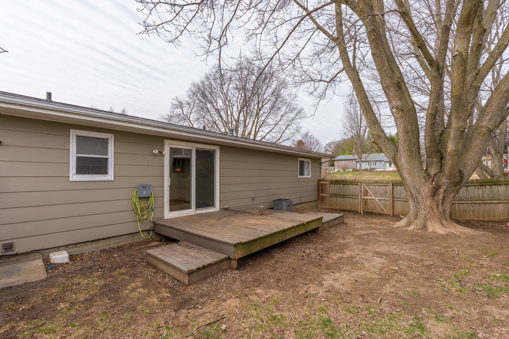 214 South 3rd Street Le Claire, IA 52753 - Photo 31 of 40 a view of house with backyard and trees
