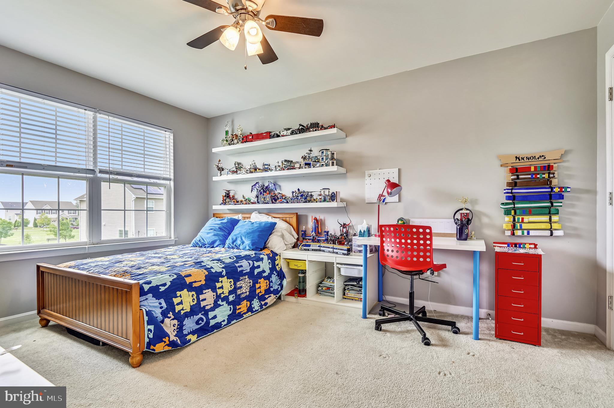 735 Daft Road Baltimore, MD 21220 - Photo 22 of 32 a bedroom with bed and a chandelier