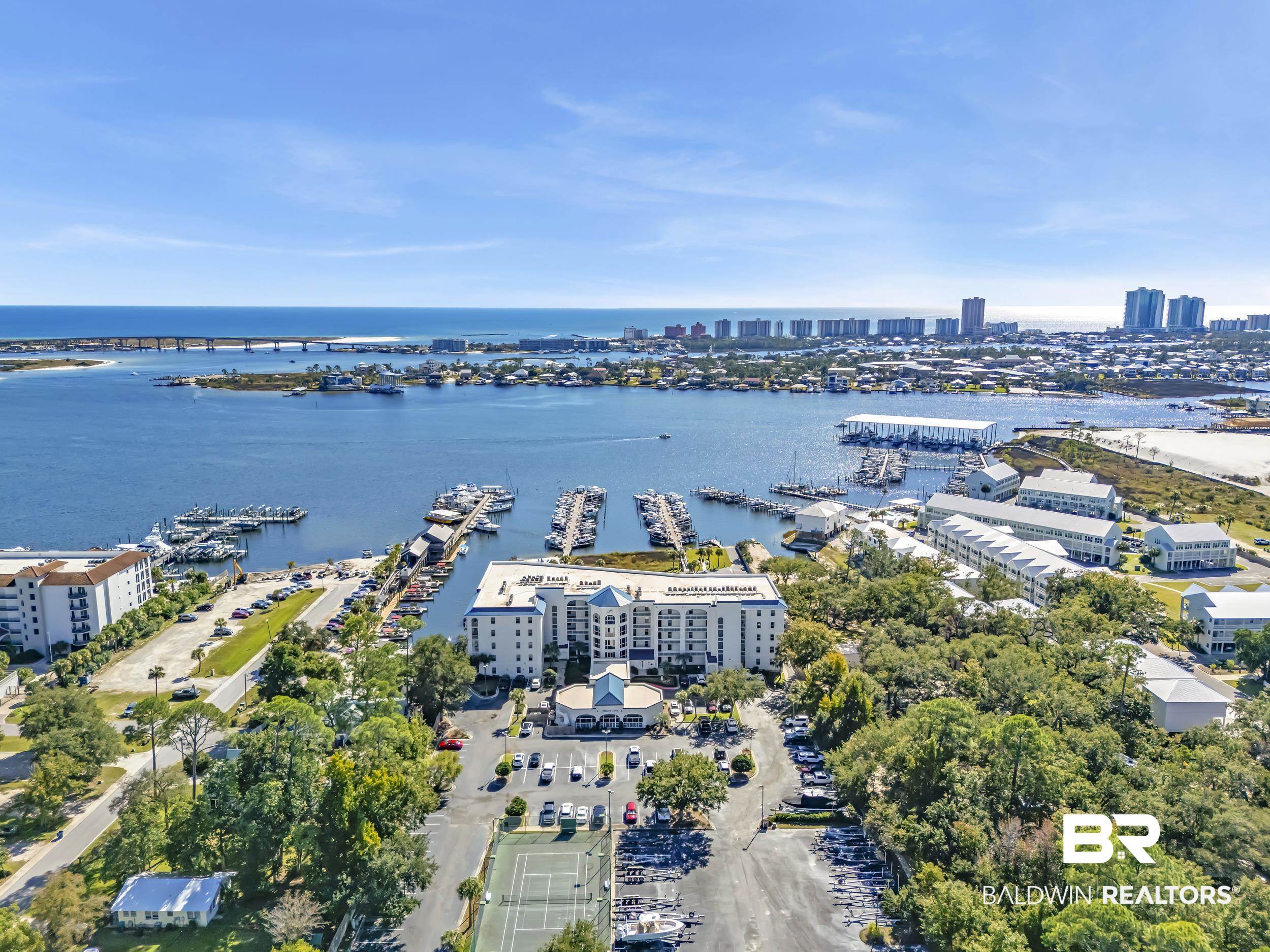 27282 Canal Road, Unit 104 Orange Beach, AL 36561 - Photo 6 of 79 View of urban area with a marina and a large body of water