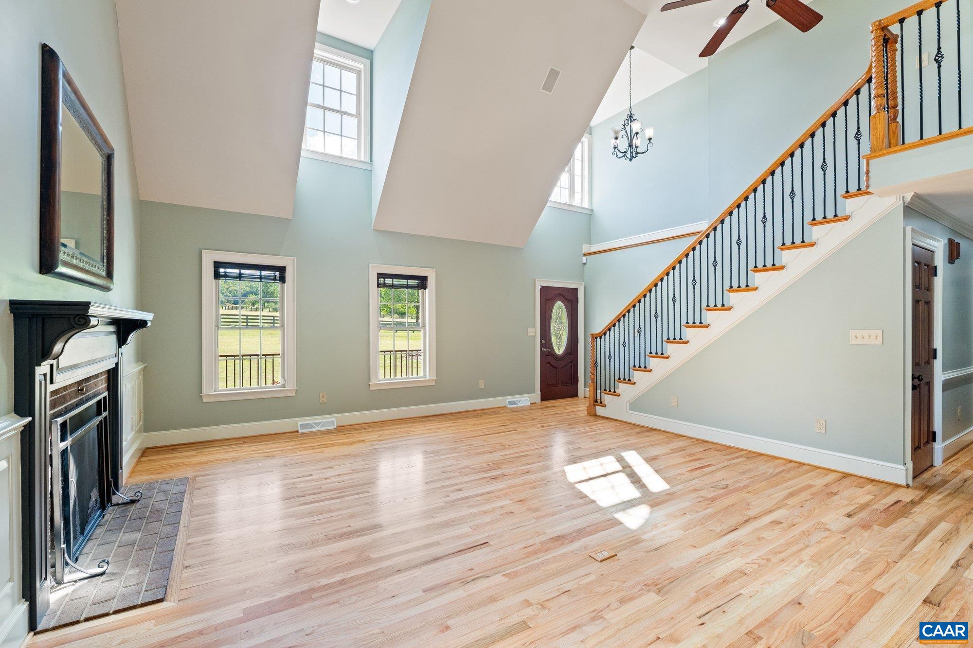 884 Pleasant Gap Drive Dry Fork, VA 24549 - Photo 18 of 72 a view of empty room with stairs and wooden floor