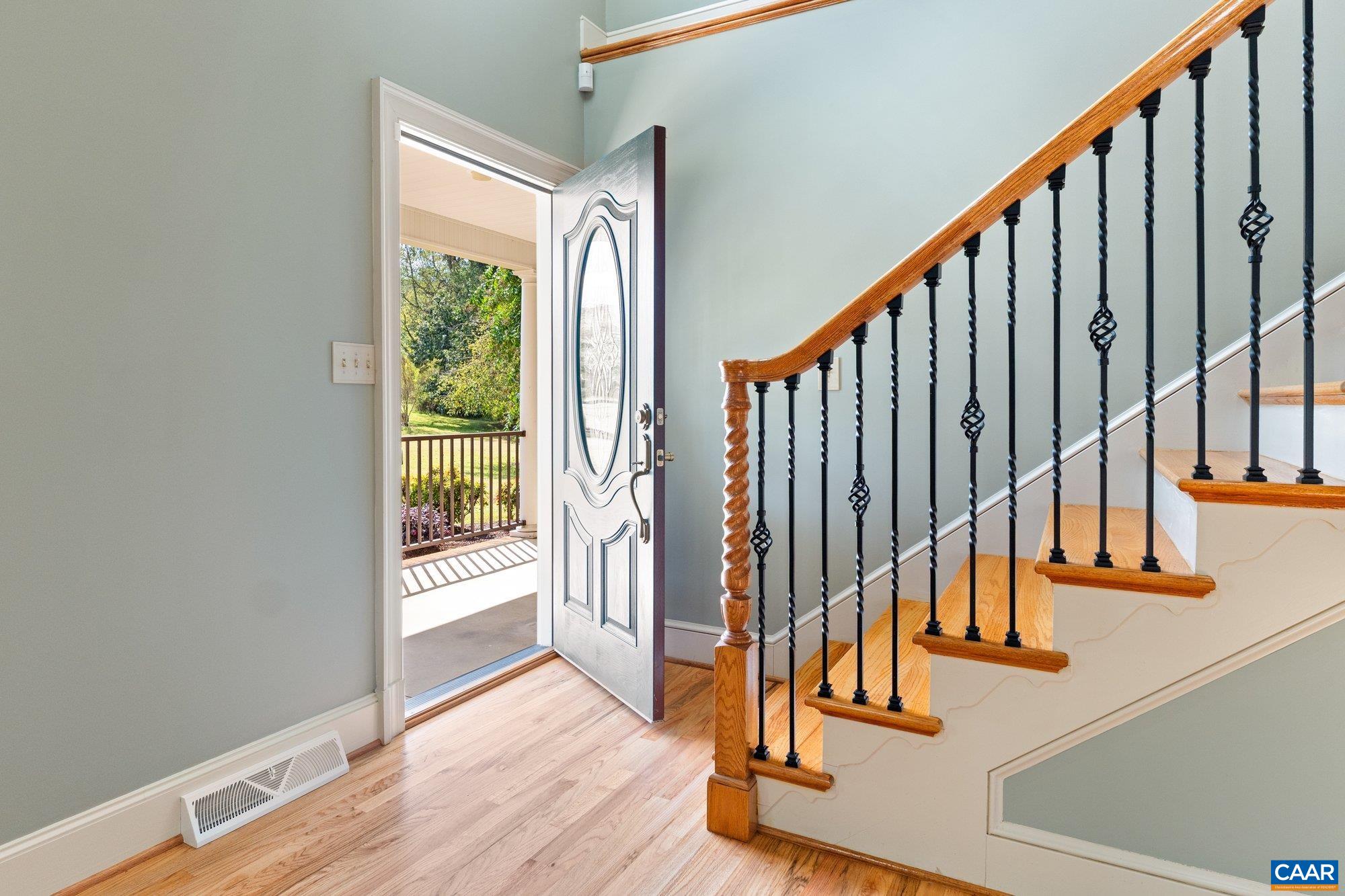 884 Pleasant Gap Drive Dry Fork, VA 24549 - Photo 19 of 72 a view of staircase with wooden floor and white walls