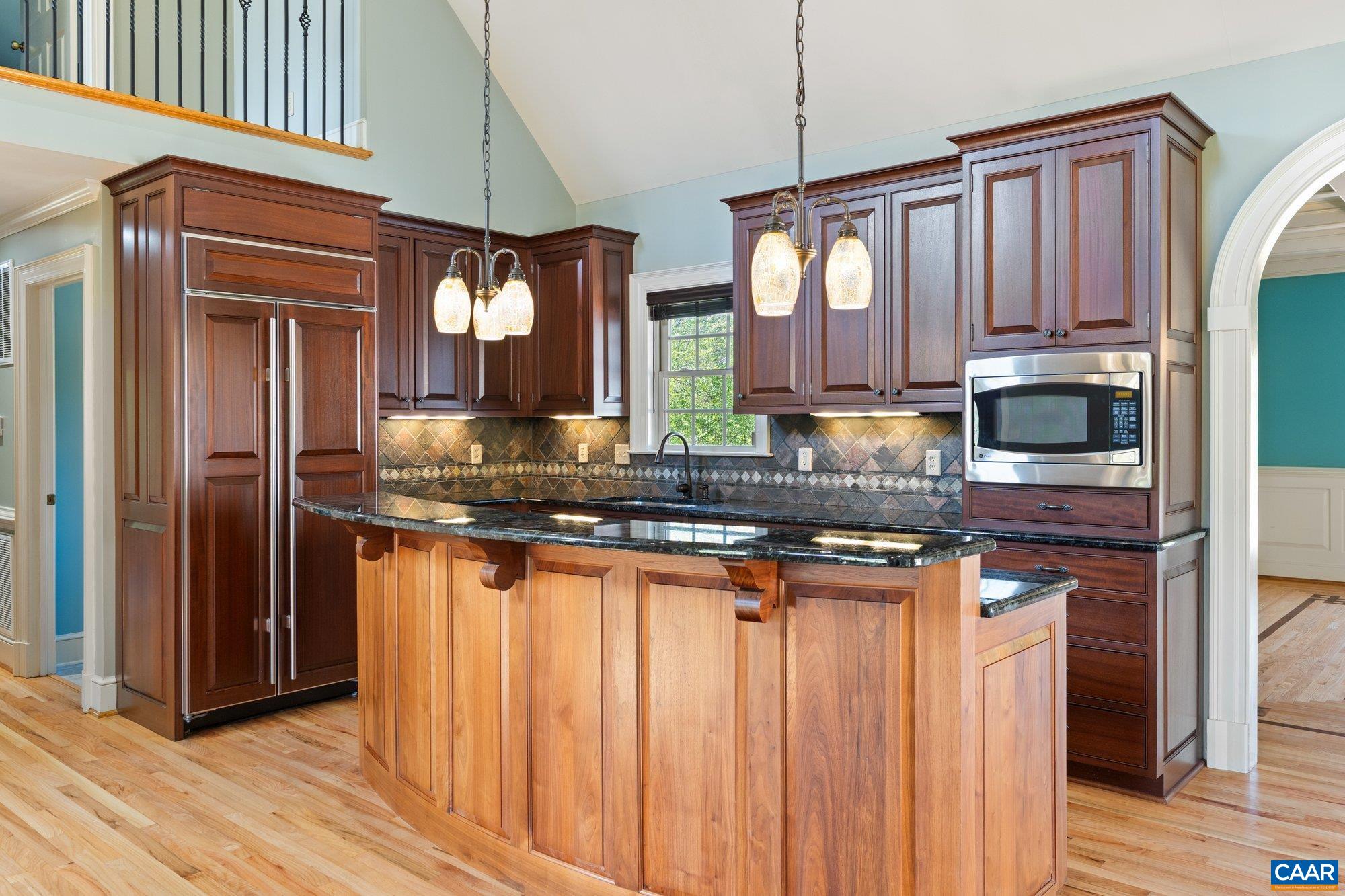 884 Pleasant Gap Drive Dry Fork, VA 24549 - Photo 22 of 72 a kitchen with stainless steel appliances granite countertop a refrigerator a stove and a sink with wooden floor