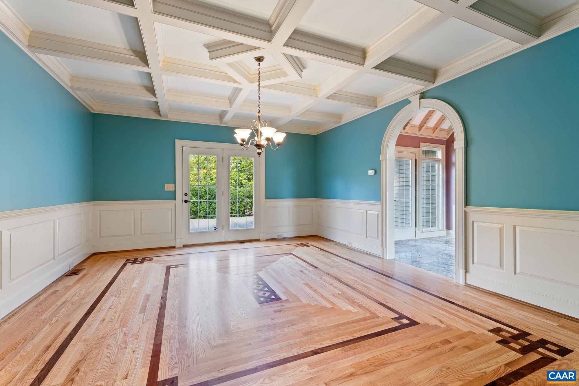 884 Pleasant Gap Drive Dry Fork, VA 24549 - Photo 28 of 72 a view of a livingroom with wooden floor a ceiling fan and kitchen space