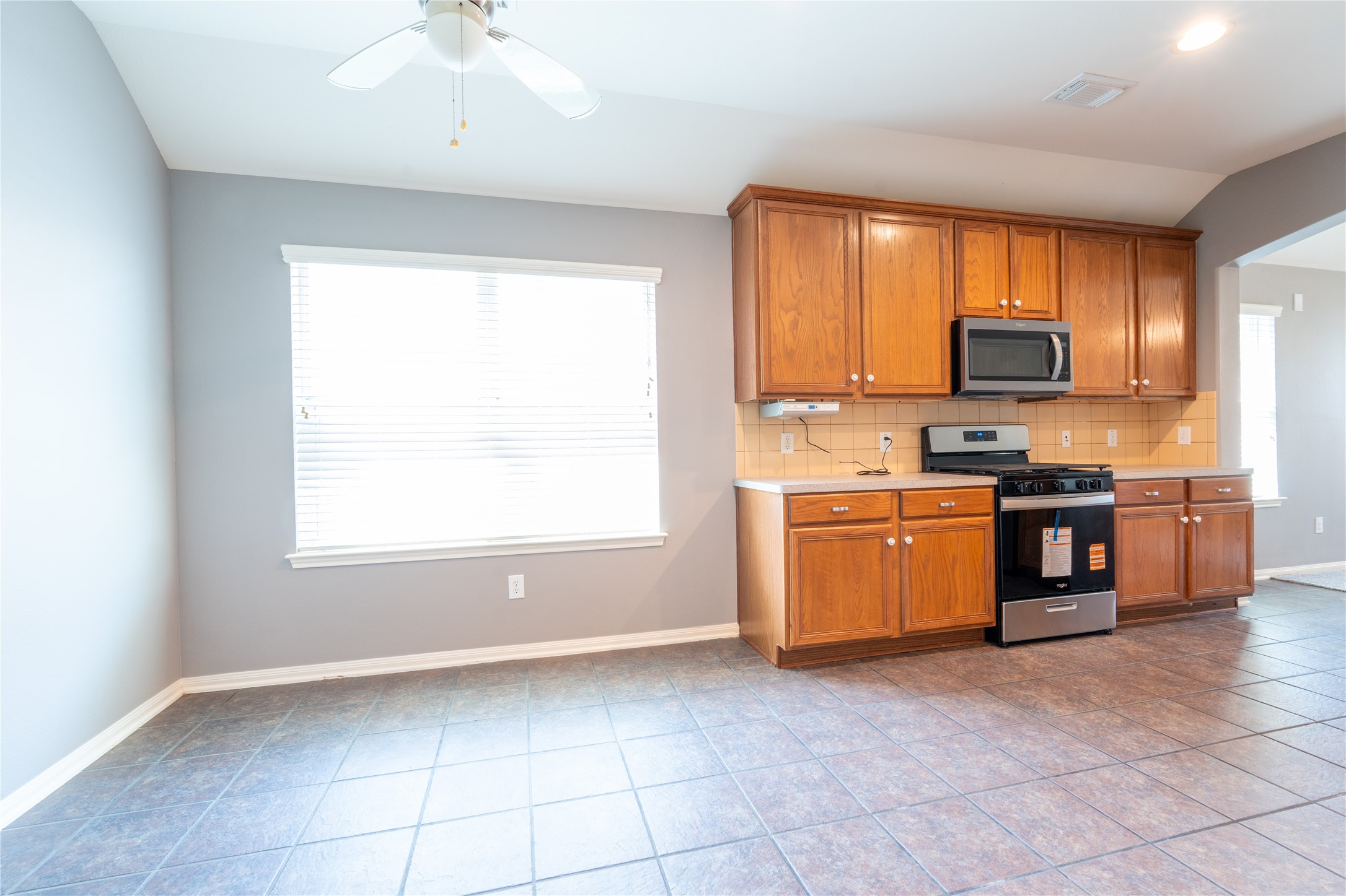 10619 Crownsedge Drive Spring, TX 77379 - Photo 8 of 38 Eat-in kitchen perfect for a breakfast nook, making the kitchen feel cozy and inviting.
