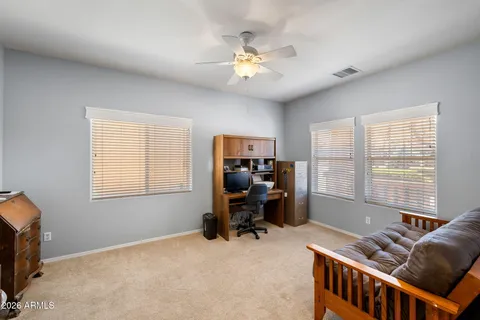 a bedroom with furniture and a window