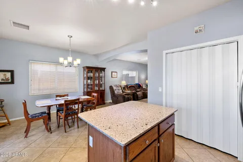 a kitchen with a table and chairs in it