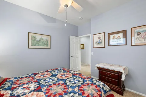 a bedroom with a bed and a dresser